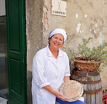 Corzano & Paterno's master cheese maker with the Buccia di Rospo cheese